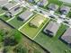 Aerial view highlighting property lines and large green backyard in a residential community at 4833 Drake Ave, Lakeland, FL 33811