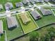 Aerial view of a neighborhood highlighting a beautiful home with a spacious yard at 4833 Drake Ave, Lakeland, FL 33811