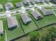 Aerial view of homes with green lawns, showcasing community layout and landscaping at 4833 Drake Ave, Lakeland, FL 33811