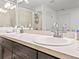 Bright bathroom features a dual sink vanity with ample lighting at 4833 Drake Ave, Lakeland, FL 33811