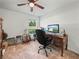 This bedroom features a ceiling fan, desk, three guitars and a window at 4833 Drake Ave, Lakeland, FL 33811