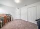 This bedroom offers two closets, plush carpet and a ceiling light at 4833 Drake Ave, Lakeland, FL 33811