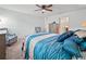 Spacious bedroom featuring comfortable seating, a ceiling fan, and a plush bed at 4833 Drake Ave, Lakeland, FL 33811