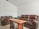 Inviting living area with plush brown seating, an area rug, and natural light at 4833 Drake Ave, Lakeland, FL 33811