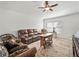 Comfortable living room with ceiling fan, plush furniture, and a decorative area rug at 4833 Drake Ave, Lakeland, FL 33811