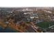 Community drone image shows a serene lake, sports fields and a beautiful small-town cityscape at 711 Springer Dr # 9, Lake Wales, FL 33853