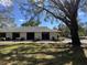 Back exterior of the home with patio at 711 Springer Dr # 9, Lake Wales, FL 33853