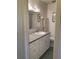 Bathroom featuring a granite vanity with white cabinets and a patterned tile floor at 711 Springer Dr # 9, Lake Wales, FL 33853