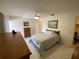 Bright bedroom featuring tile flooring, a ceiling fan, and a neutral color scheme at 711 Springer Dr # 9, Lake Wales, FL 33853