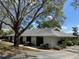 Exterior view of the side and rear of the home with landscaping at 711 Springer Dr # 9, Lake Wales, FL 33853