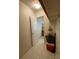 Hallway with tile floor and view into a bedroom at 711 Springer Dr # 9, Lake Wales, FL 33853