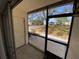 Enclosed patio with view of the front of the home and neighborhood at 711 Springer Dr # 9, Lake Wales, FL 33853