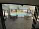 Enclosed patio area with ceiling fans, overlooking the community pool at 711 Springer Dr # 9, Lake Wales, FL 33853