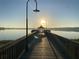 Picturesque pier view with vintage lampposts creates a peaceful setting to view the sunrise at 711 Springer Dr # 9, Lake Wales, FL 33853