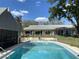 Inviting pool area with a pool house and ample seating, perfect for outdoor entertaining at 711 Springer Dr # 9, Lake Wales, FL 33853