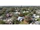 An aerial view of the home with a property outline surrounded by mature trees in a residential neighborhood at 720 S Orange Ave, Bartow, FL 33830