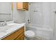 Clean bathroom with tub-shower combination, tiled walls, and vanity sink at 720 S Orange Ave, Bartow, FL 33830