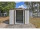 A backyard shed with open doors for storing tools and equipment, perfect for organization at 720 S Orange Ave, Bartow, FL 33830