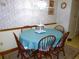 Cozy dining area featuring a round table with seating for six at 9 Silver Sand Rd, Frostproof, FL 33843