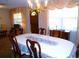 Formal dining room with chandelier and large window at 9 Silver Sand Rd, Frostproof, FL 33843