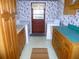 Functional laundry room with wooden cabinets, washer, dryer, and ample counter space at 9 Silver Sand Rd, Frostproof, FL 33843