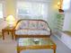 Bright living room with wicker furniture and shelving at 9 Silver Sand Rd, Frostproof, FL 33843