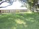 Large yard with beautiful birds walking on the lawn at 1077 Medinah Way, Winter Haven, FL 33884