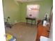 Green bedroom with neutral carpet, window, side table, and dresser at 1077 Medinah Way, Winter Haven, FL 33884