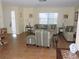 Comfortable living room with tile flooring, neutral decor, and bright natural light at 1077 Medinah Way, Winter Haven, FL 33884