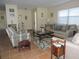 Cozy living room featuring comfortable seating, tile flooring, and a bright, airy atmosphere at 1077 Medinah Way, Winter Haven, FL 33884