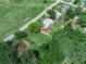 This stunning aerial perspective captures the harmonious blend of lush trees and a well-maintained home at 111 D St, Frostproof, FL 33843