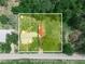 Aerial view of the property, highlighting its expansive lot and surrounding greenery at 111 D St, Frostproof, FL 33843