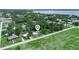 Aerial view of the property showing its location in a charming neighborhood near a lake at 111 D St, Frostproof, FL 33843