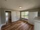 Bedroom featuring wood floors, natural light, closet, and neutral color at 111 D St, Frostproof, FL 33843