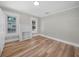 Comfortable bedroom featuring an eye-catching decorative fireplace and luxury vinyl plank flooring at 111 D St, Frostproof, FL 33843