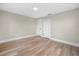 Bright bedroom with light-colored walls, wood-look floors, and white trim at 111 D St, Frostproof, FL 33843