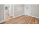 Inviting foyer with luxury vinyl plank flooring and access to the bathroom and other areas of the home at 111 D St, Frostproof, FL 33843