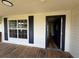View of the front porch with a doorway leading into the house at 111 D St, Frostproof, FL 33843