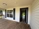 View of the front porch with a doorway leading into the house at 111 D St, Frostproof, FL 33843