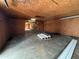 Spacious garage interior with exposed ceiling and concrete floors, offering ample storage at 111 D St, Frostproof, FL 33843