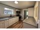 Charming kitchen with granite counters and stainless steel appliances at 111 D St, Frostproof, FL 33843