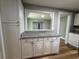 Kitchen view showing pass-through, lower cabinets, and granite countertops at 111 D St, Frostproof, FL 33843