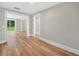 Spacious living room featuring luxury vinyl plank flooring and ample natural light at 111 D St, Frostproof, FL 33843