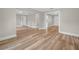 Open-concept living room featuring luxury vinyl plank flooring and ample natural light at 111 D St, Frostproof, FL 33843