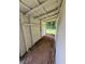 Shed interior featuring concrete floors and corrugated metal walls at 111 D St, Frostproof, FL 33843