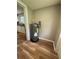 The home features a utility area with modern water heater and wood-look flooring at 111 D St, Frostproof, FL 33843