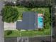 Aerial view of home and pool, surrounded by lush landscaping at 1144 Cephia St, Lake Wales, FL 33853