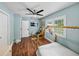 Bright bedroom features a playhouse bed, wood floors, and a window for natural light at 1144 Cephia St, Lake Wales, FL 33853