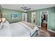Comfortable bedroom features a television, closet, and en suite bathroom for added convenience at 1144 Cephia St, Lake Wales, FL 33853
