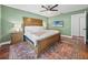 Comfortable bedroom showcases wood accents, fan, a television, and neutral furnishings at 1144 Cephia St, Lake Wales, FL 33853